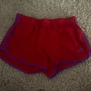 red Adidas shorts with purple details